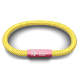 This Woman Runs Solid Yellow Cord NOTCH Bracelet with Pink Clasp